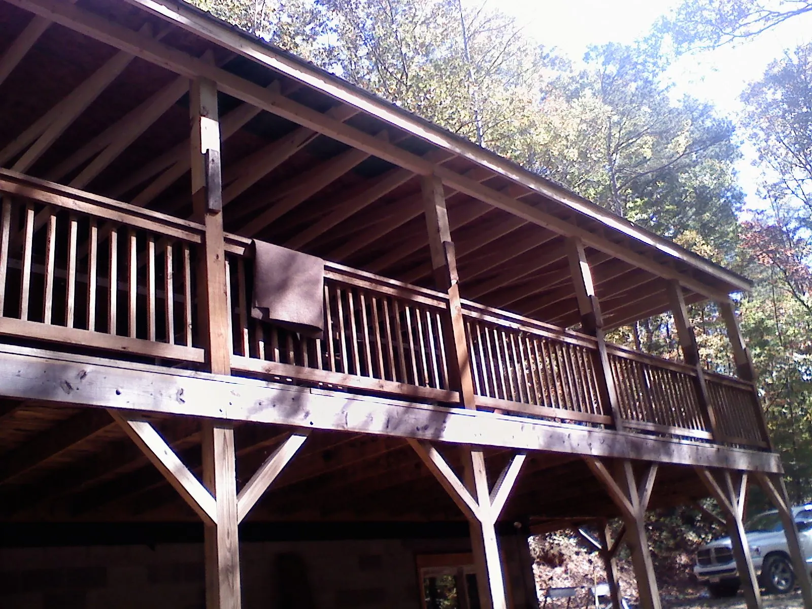 Timber framing under a new elevated porch and deck — Roof Leak Repair in Hamshire by Roofing Brothers